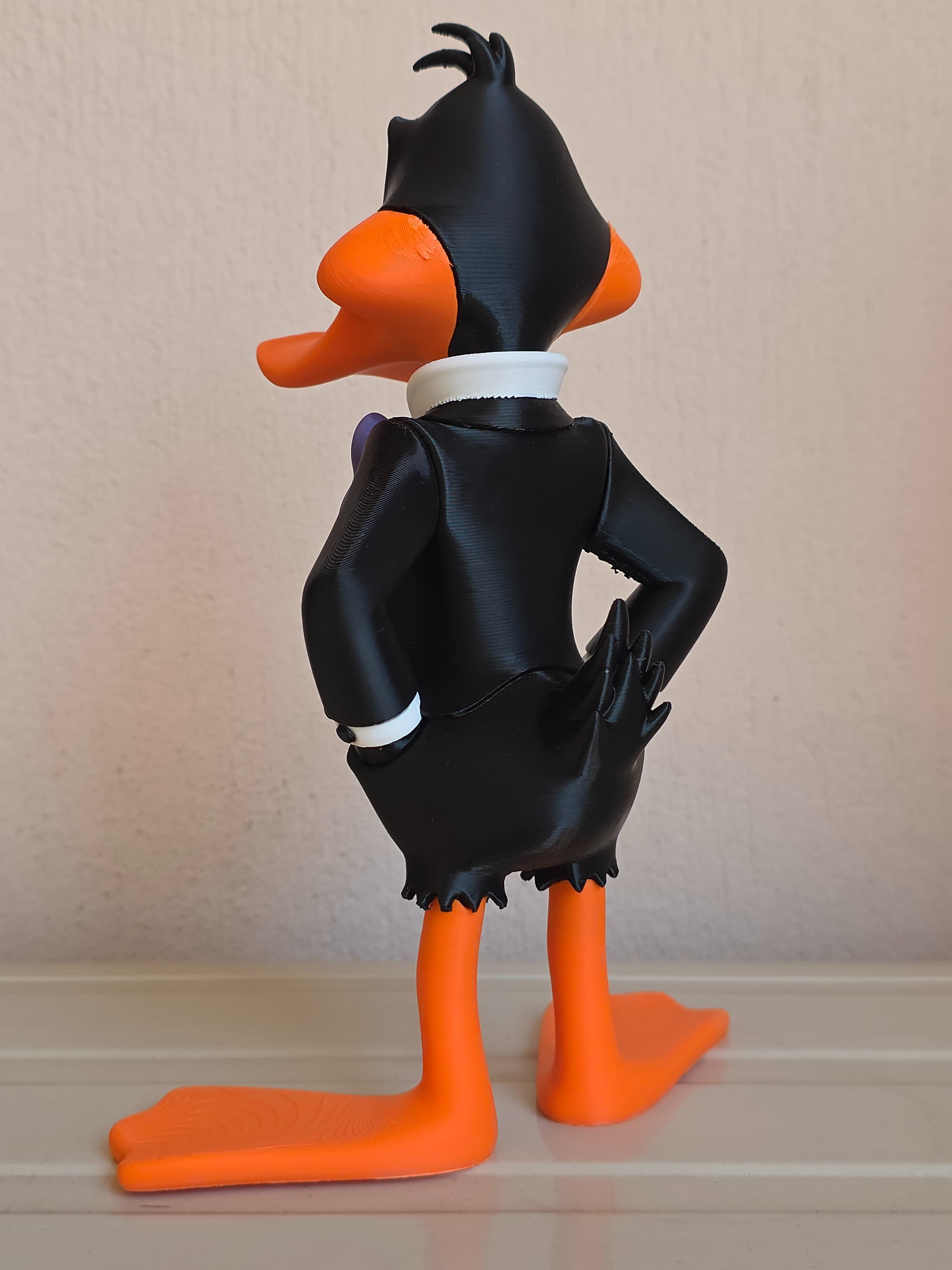 Daffy Duck en smoking — figurine multicolore