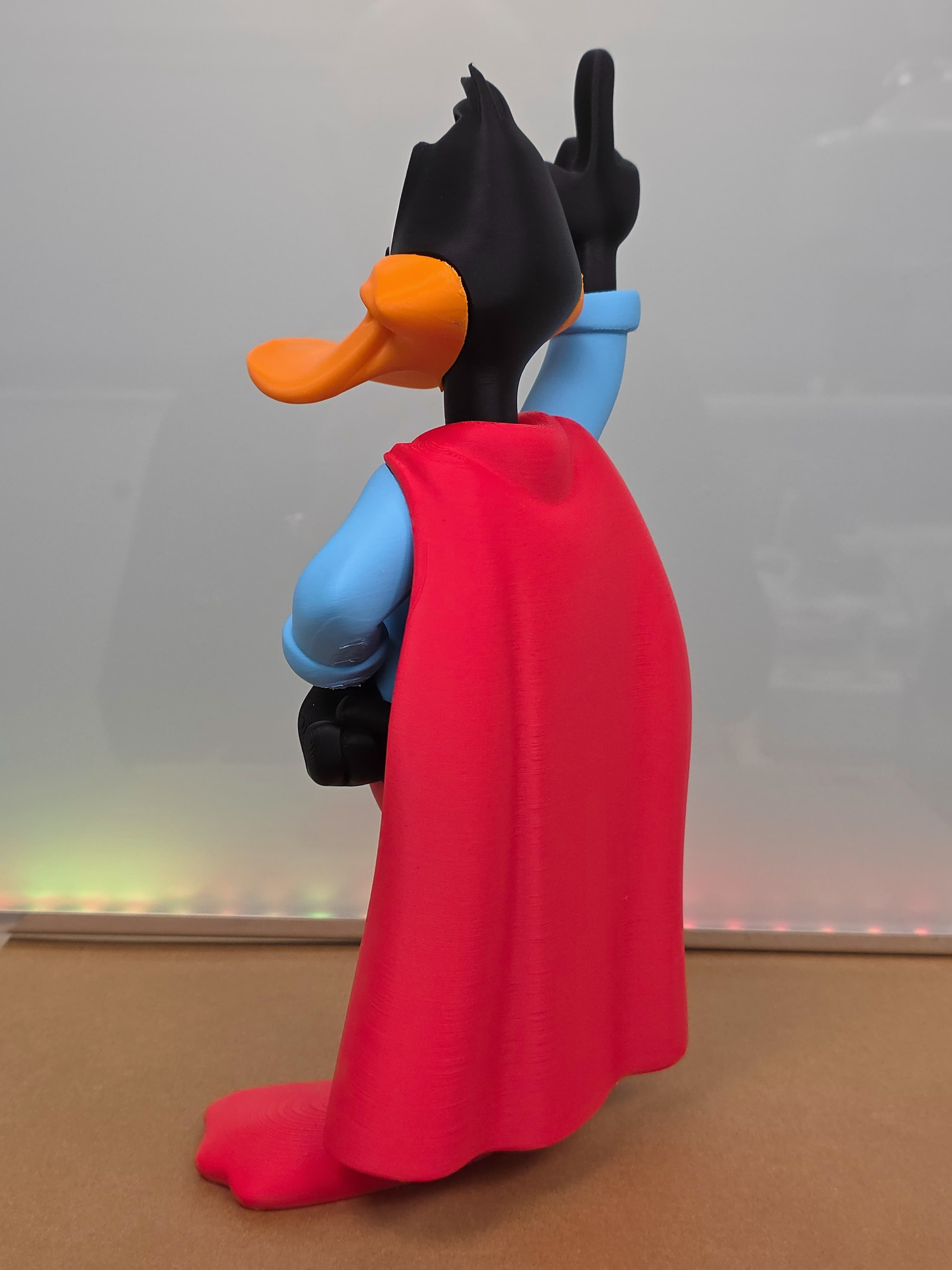 Daffy Duck en Superman — figurine multicolore