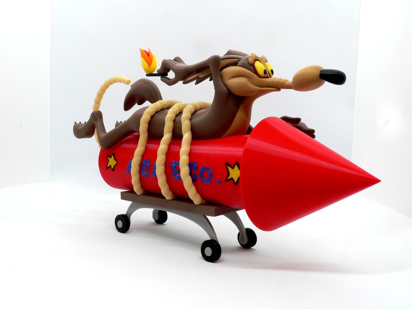 Vil Coyote (fusée ACME) — figurine multicolore
